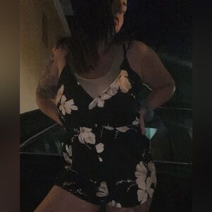 Black floral spaghetti strap romper in size medium